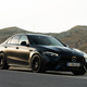 2023 mercedes-amg c 63 s e-performance in matte black photographed on the side of a mountain road in spain